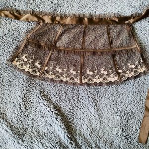 Sheer apron with embroidery trim